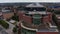 Ascending footage of Television centre building. Geometric shapes modern design building with large terrace. London, UK