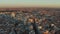 Ascending footage of town at sunset. Aerial panoramic shot of city centre with famous shopping Gran Via street.