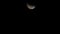 Ascending Moon Over Black Background Center