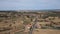 Ascending over vintage village in the plain, Spain