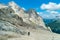 Ascent to Marmolada, Dolomites, Italy. The Marmolada Glacier. Tourist climbing on Marmolada mountain in dolomites. Ice axe in the