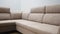 Ascetic corner sofa with stylish beige textile upholstery