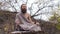 Ascetic yogi sitting in meditation
