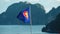 ASEAN  community flags blowing in island background.