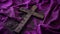 Ash Wednesday still life of a wooden cross lying on a purple cloth, ashes scattered around, reflective and spiritual
