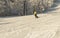 ASHA, RUSSIA - 27 april 2011: snowboarder descends on snow-covered slope and makes a turning maneuver, face is not visible,