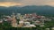 Asheville city in North Carolina at sunset. Downtown architecture with high buildings and Appalachian mountain hills in