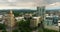 Asheville city in North Carolina at sunset. Downtown architecture with high buildings and Appalachian mountain hills in