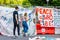 ASHEVILLE, NORTH CAROLINA, USA-June 1, 2021-Young couple read the protest signs in Pack Square Park in June 2021