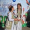 ASHGABAT, TURKMENISTAN - January, 04, 2017: Two unknown young girls in national clothes laugh and talk. ASHGABAT, TURKMENISTAN -