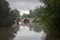 Ashlar stone medieval bridge, puente mayor, crossing rio carrion, in autumn. Palencia, Spain