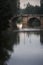 Ashlar stone medieval bridge, puente mayor, crossing rio carrion, in autumn. Palencia, Spain