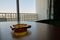 Ashtray on a hotel table with window view