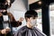 Asia Barber Shop Hair cut queueing customer`s wearing face mask prevention business reopening