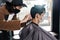 Asia Barber Shop Hair cut queueing customer`s wearing face mask prevention business reopening