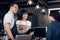 Asia barista waiter and waitress take order from customer in coffee shop,Two cafe owner writing drink order at counter bar,Food