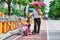 Asia Chinese family grandfather and granddaughter walk on road