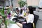 Asia Chinese office lady woman girl on chair make a call use desk phone chat work smile wear business occupation suit workplace