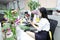 Asia Chinese office lady woman girl on chair make a call use desk phone chat work smile wear business occupation suit workplace