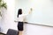 Asia Chinese office lady woman girl hand write success at whiteboard work smile wear business occupation suit workplace