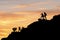 Asia couple hiking help each other silhouette in mountains with sunlight. couple hiking help each other silhouette in mountains