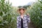 Asia farmer in middle corn farm