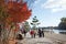 Asia, Japan. Kyoto, Sagano, Arashiyama, people walking next to river,