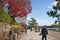 Asia, Japan. Kyoto, Sagano, Arashiyama, people walking next to river,