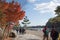 Asia, Japan. Kyoto, Sagano, Arashiyama, people walking next to river,