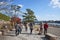 Asia, Japan. Kyoto, Sagano, Arashiyama, people walking next to river,