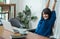 Asia woman relax after working,female raise arm up stretching in