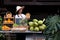 Asia woman selling natural variety of fruits at the farm stay, Homestay at Thailand Loei