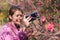Asia woman take image cherry blossom by smartphone in sun moon lake taiwan, Selective focus