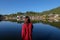 asia women traveller stand near reflect lake looking out to view of old house at ban ruk thai Mae Hong Son