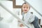 Asian 10 months old toddler baby girl child climbing up stairs at home alone, Looking and smiling at camera, Movement, Balance &