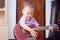 Asian 18 months / 1 year old baby boy child hold & play Hawaiian guitar or ukulele