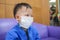 Asian 2 -3 years old toddler baby boy child wearing protective medical mask