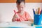 Asian 2 - 3 years old young toddler boy child drawing, scribbling with pen color markers, kid write in living room at home,