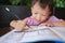 Asian 3 - 4 years old toddler boy child writing / drawing with pencil, Student doing homework