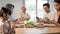 Asian Addicted family use mobile phone while eating breakfast on table. Upset Elderly grandfather feel unhappy angry and troubled