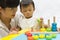 Asian adorable baby one year is playing color puzzle pyramid for