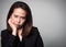 Asian adult woman boring face. Portrait of business women in black suit on white background.