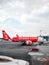 An Asian Airlines passenger airliner parked outside the airport terminal