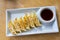 Asian appetizer menu fried dumplings with soy sauce