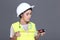 Asian Architect Engineer woman in white hard hat, safety vast, p