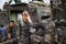 Asian army soldier with gun during the military operation in the field