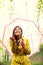 Asian Autumn woman happy after rain under umbrella