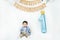Asian baby boy celebrating first birthday for 1 year.Infant,small cute child dressed in t-shirt and blue shirt sitting on the