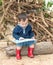 Asian baby boy reading tale book ,The Boy wear red boot sittin