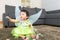 Asian baby girl with halloween party dressing and play toy block